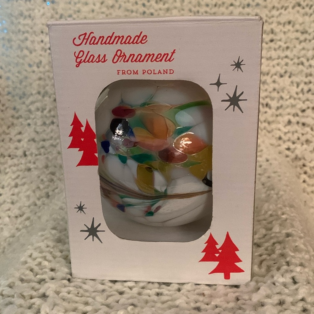 Hand blown glass holiday ornament by Zorza.